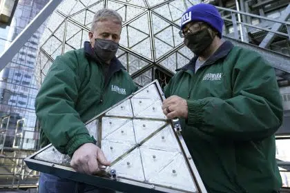 Workers Install 192 Crystals on Times Square New Year’s Ball