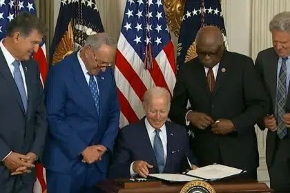 Biden Signs Inflation Reduction Act in Modest White House Ceremony